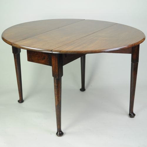 Fine quality figured mahogany oval drop leaf dining table