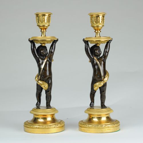 Fine pair of bronze & ormolu putti candlesticks