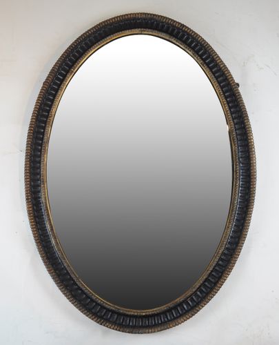 Mid 18th century oval black and gilt Mirror