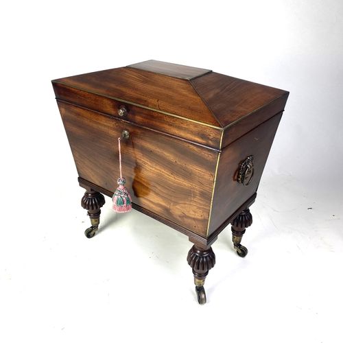 Small Regency mahogany sarcophagus shaped Cellarette 