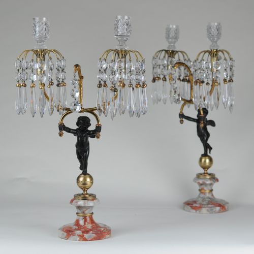 Bronze & ormolu lustre-drop candelabra supported by putti 