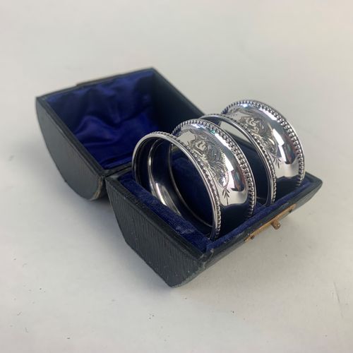 Pair of cased silver napkin rings