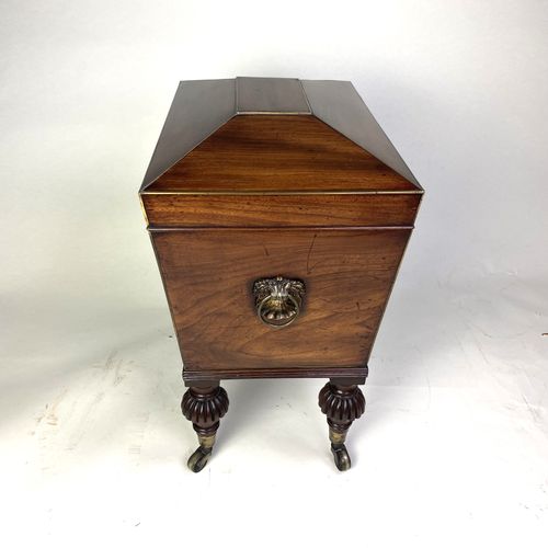 Small Regency mahogany sarcophagus shaped Cellarette 