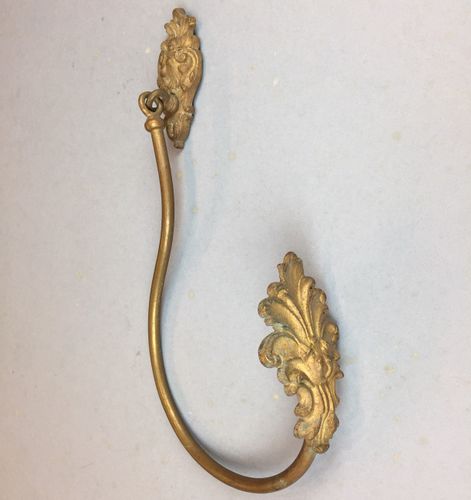 Antique gilded brass curtain tie-back