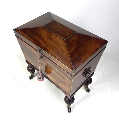 Small Regency mahogany sarcophagus shaped Cellarette 