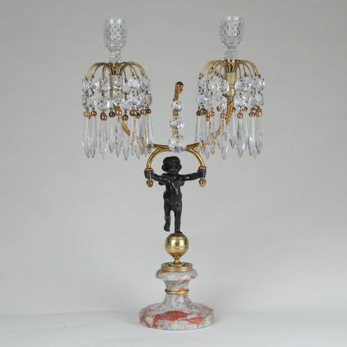 Bronze & ormolu lustre-drop candelabra supported by putti 