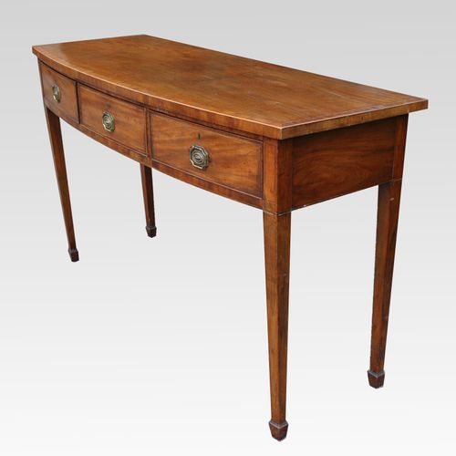 A George III mahogany bow fronted three drawer side/serving table/sideboard