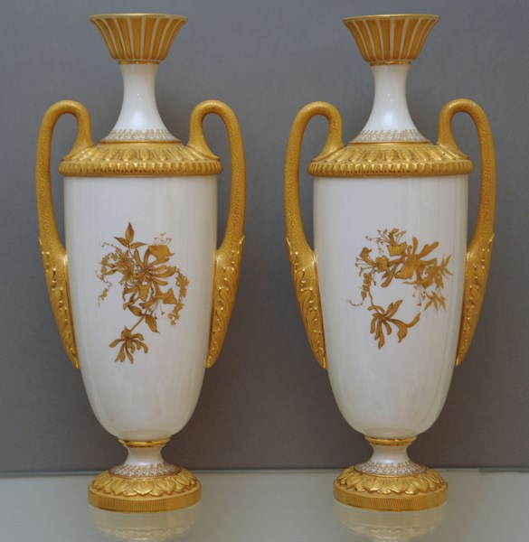 A  very good pair of Royal Worcester two-handled vases