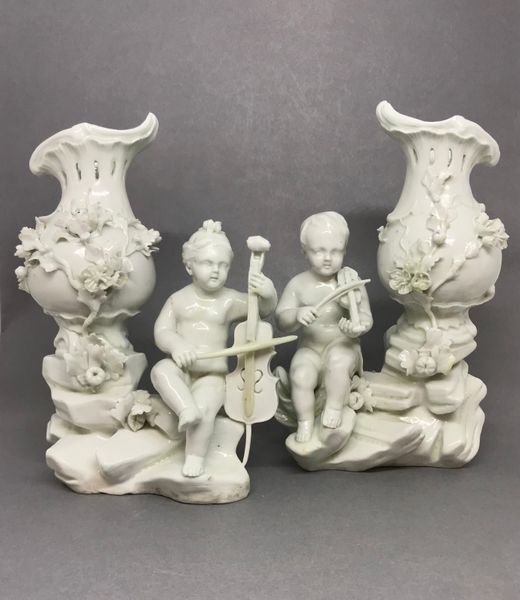 Pair of Tournai Figures of Children Playing Musical Instruments