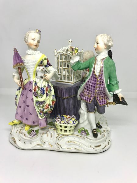 Meissen Group of Three Figures Around a Bird Cage